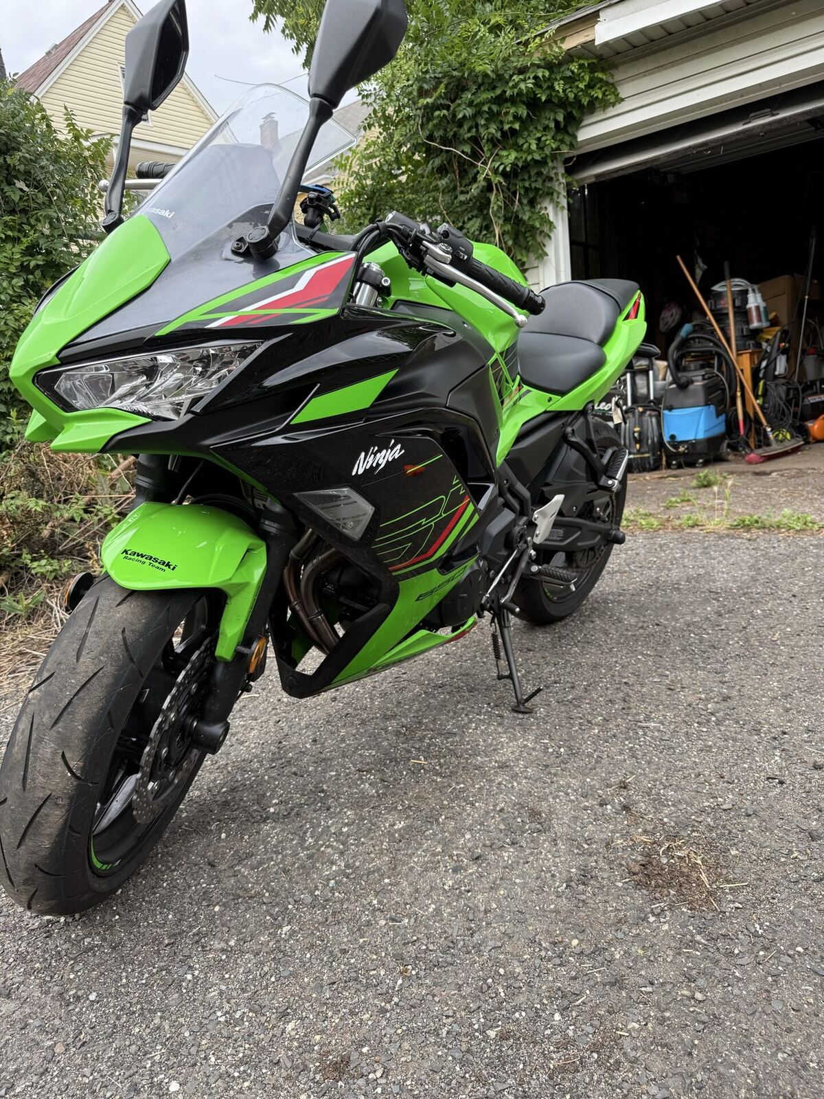 Front three-quarter view of the Ninja 650 KRT Edition showing lime green and black race livery